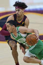 Boston Celtics' Tremont Waters (51) drives against Cleveland Cavaliers' Brodric Thomas (33) during the first half of an NBA basketball game, Wednesday, May 12, 2021, in Cleveland. (AP Photo/Tony Dejak)