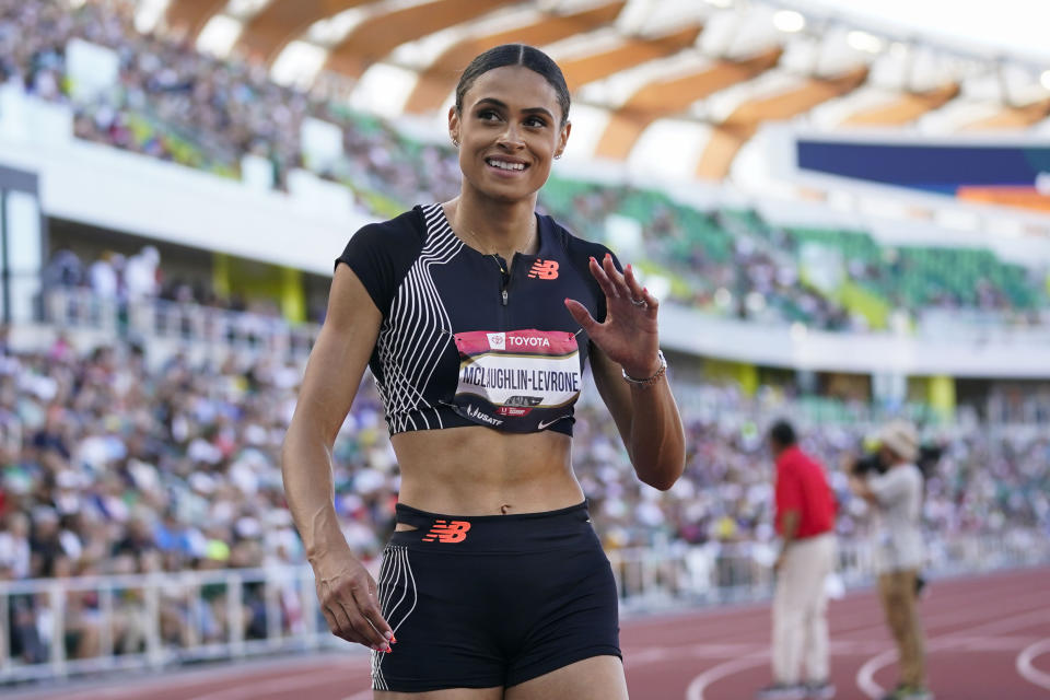 FILE - Sydney McLaughlin-Levrone waves to the crowd after winning the women's 400 meters during the U.S. track and field championships in Eugene, Ore., Saturday, July 8, 2023. (AP Photo/Ashley Landis, File)