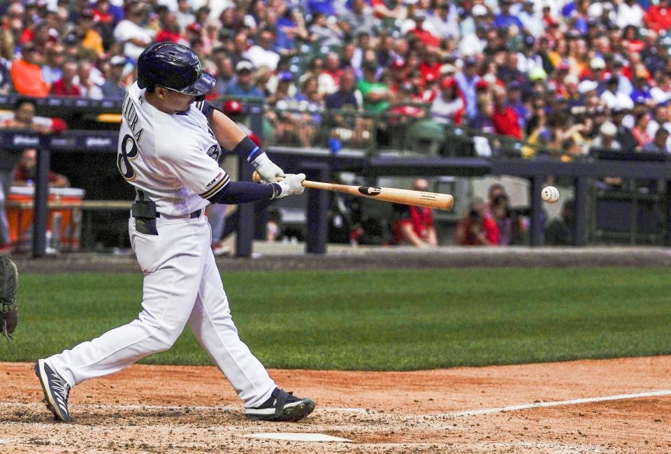 Milwaukee Brewers' Keston Hiura hits an RBI double during the eighth inning of a baseball game against the St. Louis Cardinals Wednesday, Aug. 28, 2019, in Milwaukee. (AP Photo/Morry Gash)