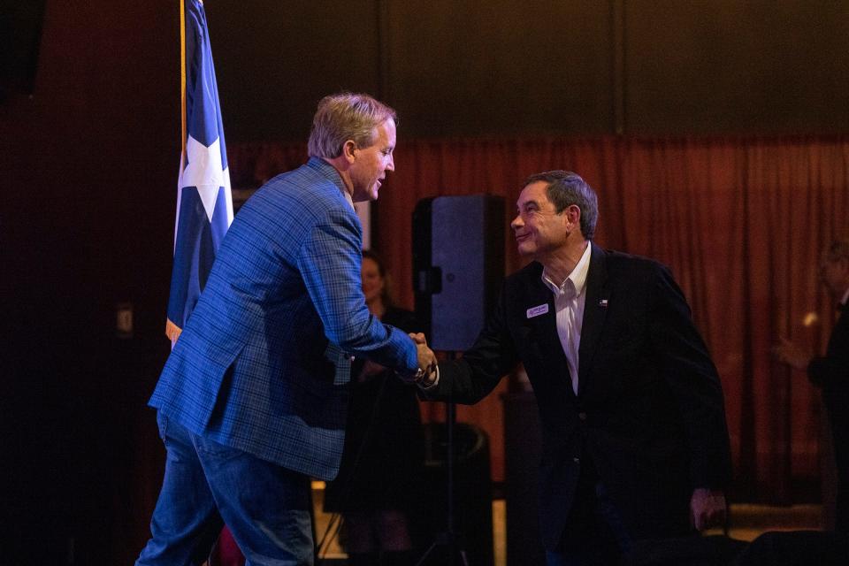 Attorney General Ken Paxton shakes hands with Tom Glass at Film Alley in Bastrop on Jan. 24.