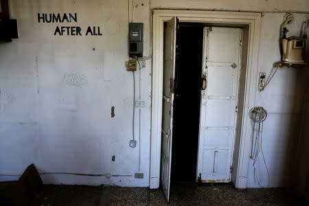 A door is seen at the Cavallerizza Reale building, which is occupied by the "Assemblea Cavallerizza 14:45" movement in Turin, Italy July 16, 2016. REUTERS/Marco Bello