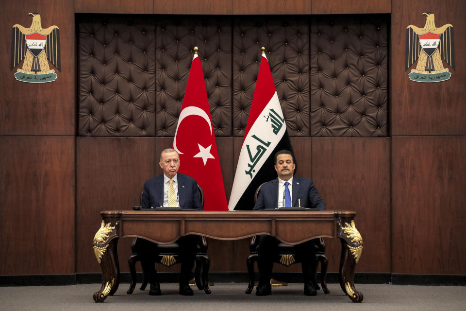 Iraq's Prime Minister Mohammed Shia al-Sudani, right, and Turkey's President Recep Tayyip Erdogan sit together during their meeting in Baghdad, Iraq, Monday April 22, 2024. (Ahmad Al-Rubaye/Pool via AP)