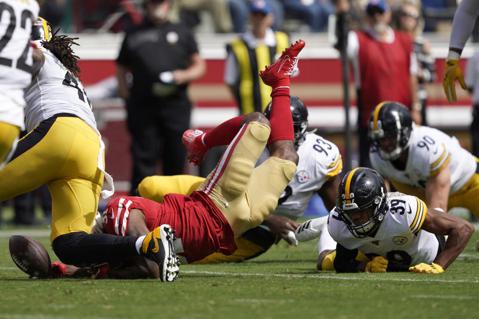 San Francisco 49ers running back Raheem Mostert, bottom left, fumbles the ball in front of Pittsburgh Steelers free safety Minkah Fitzpatrick (39) during the first half of an NFL football game in Santa Clara, Calif., Sunday, Sept. 22, 2019. (AP Photo/Tony Avelar)