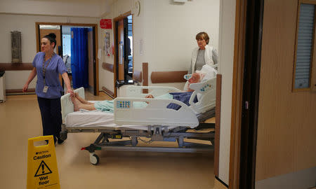 Inpatient Donald Ritson and his wife Linda Ritson arrive to Ward 24 in Milton Keynes University Hospital in Milton Keynes, central England, Britain, May 22, 2018. REUTERS/Hannah McKay