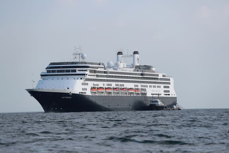 An offshore supply vessel is seen next to the cruise ship MS Rotherdam, which brought supplies and Covid-19 test kits to the MS Zaandam, where four passengers died, pictured off the coast of Panama City