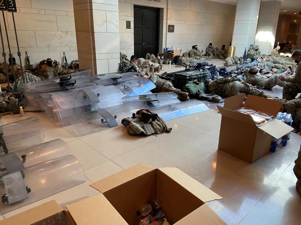 Riot shields are stockpiled in the Capitol where National Guard members rest Jan. 13.