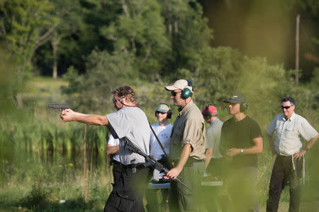 A trainee shoots a handgun as he takes part in the Cherev Gidon Firearms Training Academy in Honesdale, Pennsylvania, U.S. August 5, 2018. REUTERS/Noam Moskowitz