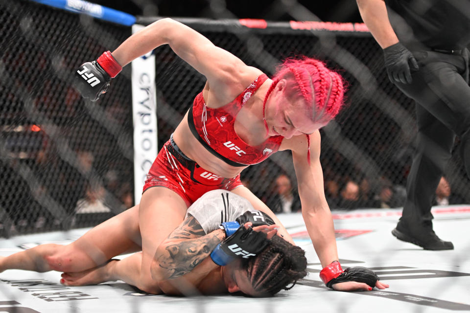 Jan 20, 2024; Toronto, Canada, USA; Gillian Robertson (red glove) fights Polyana Viana (blue gloves) during UFC 297 at ScotiaBank Arena. Mandatory Credit: Dan Hamilton-USA TODAY Sports