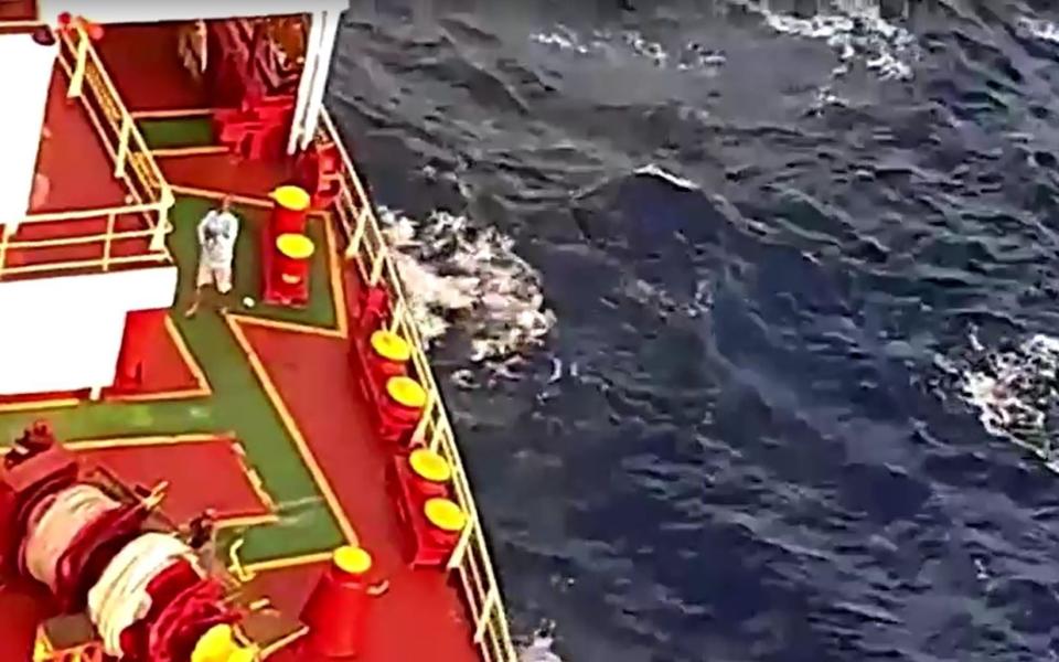 Somali pirates aboard cargo ship Ruen after it was intercepted by the Indian Navy