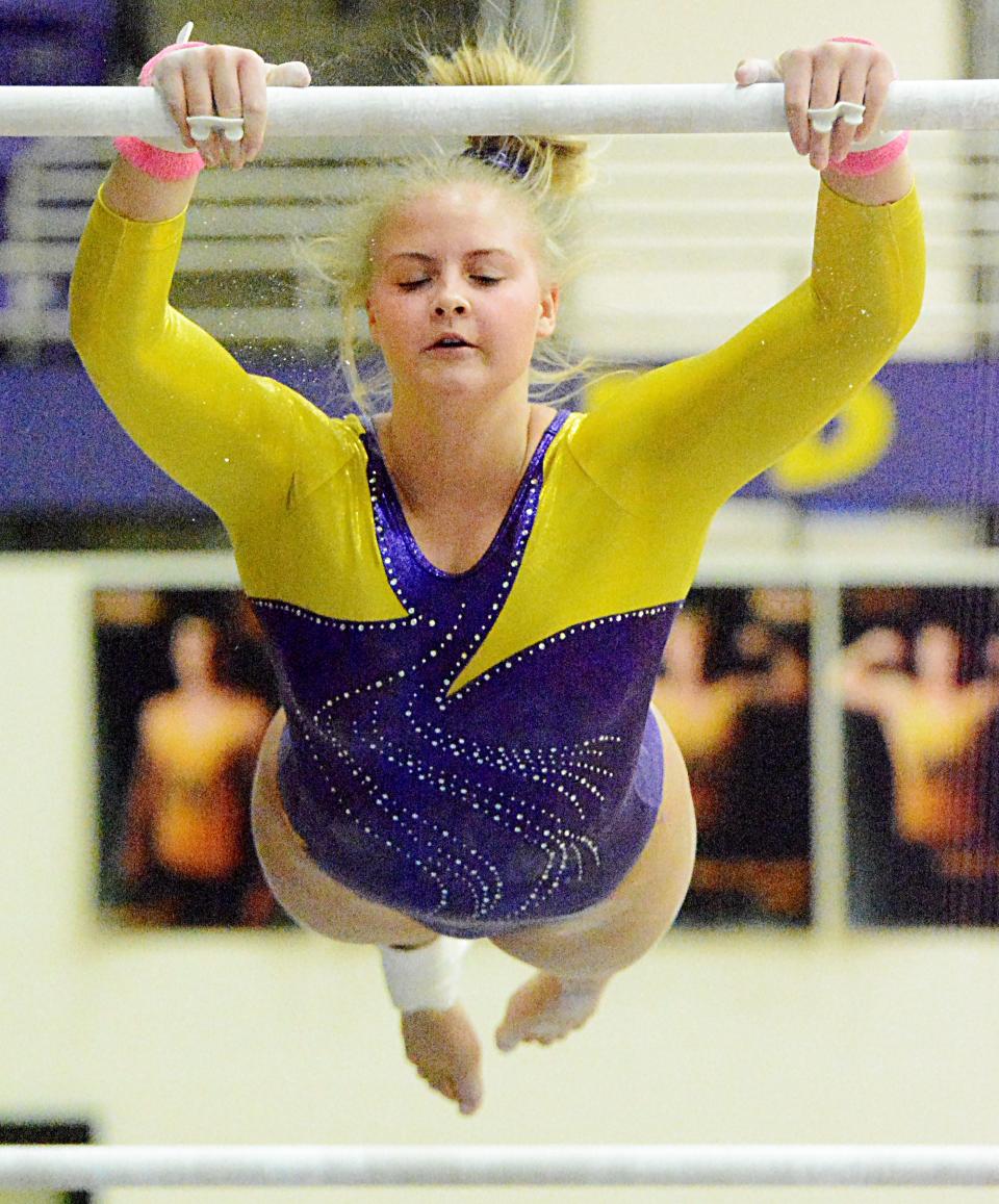 Watertown's Natalie Benson competes on the uneven bars during a high school gymnastics triangular Tuesday in the Civic Arena. The Arrows finished second in the meet behind Sioux Falls O'Gorman.