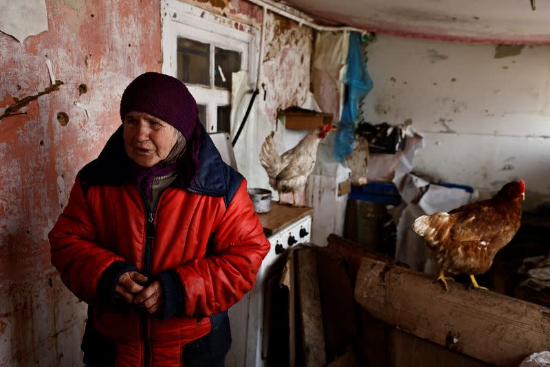 The Wider Image: Behind enemy lines, Ukrainian woman survives with her chickens
