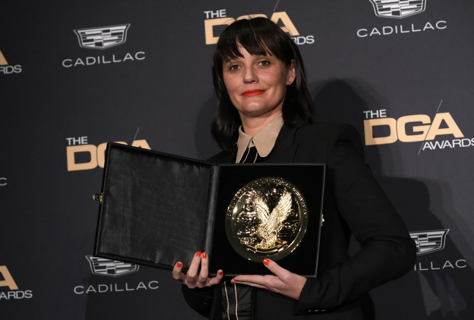 Kim Gehrig poses in the press room with the award for outstanding directorial achievement in commercials at the 75th annual Directors Guild of America Awards on Saturday, Feb. 18, 2023, at the Beverly Hilton hotel in Beverly Hills, Calif. (AP Photo/Chris Pizzello)