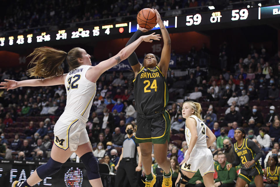 Baylor's Sarah Andrews (24) shoots over Michigan's Leigha Brown (32) in overtime of an NCAA college basketball game, Sunday, Dec. 19, 2021, in Uncasville, Conn. (AP Photo/Jessica Hill)