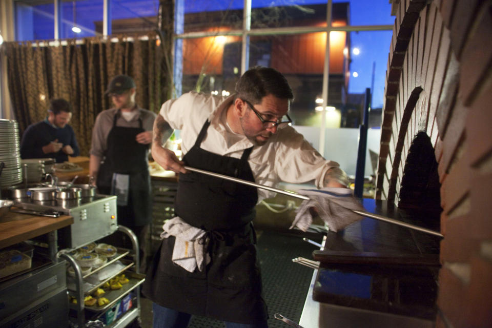 In this Jan. 27, 2011 photo, Jason French of the Ned Ludd restaurant prepares charred Brussels sprouts with lemon and chili flakes in Portland, Ore. Far from the expectant gaze of major restaurant critics and the accompanying pressure to produce the Next Big Thing, the little-big city of Portland offers chefs a unique opportunity - the chance to experiment. (AP Photo/The Oregonian, Brian Feulner)