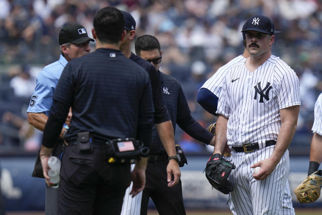 Yankees' Carlos Rodon throwing but delayed by back tightness