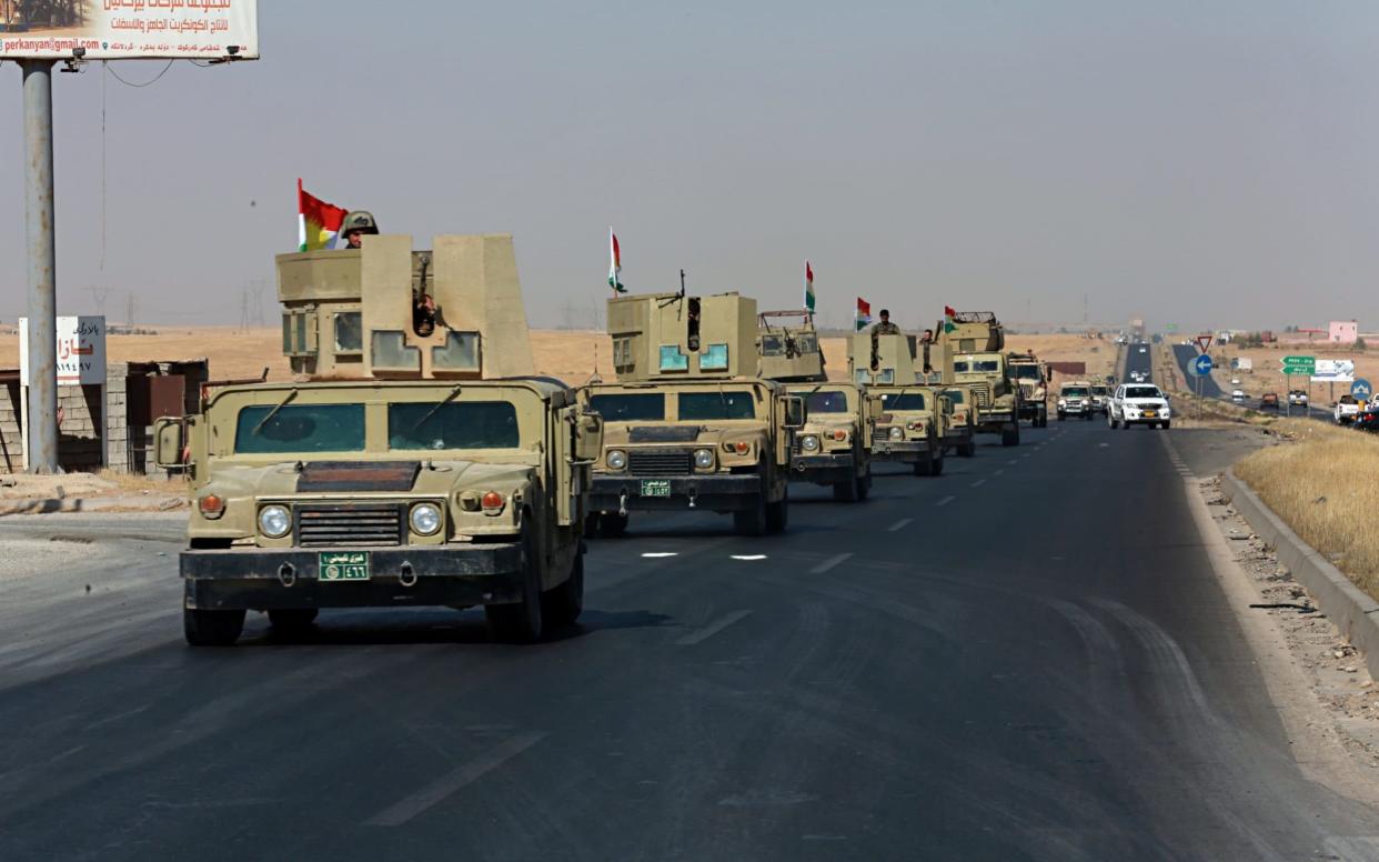 Kurdish security forces head to Alton Kupri town, on the outskirts of Irbil, Iraq, Friday - AP