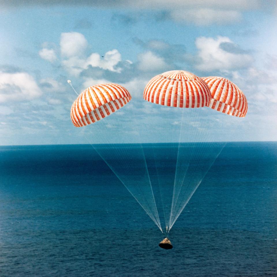 The Apollo 14 command module with astronauts Alan Shepard, Stuart A. Roosa and Edgar Mitchell aboard approaches touchdown in the South Pacific Ocean, bringing to successful end a 10-day lunar landing mission. The splashdown occurred Feb. 9, 1971, approximately 765 nautical miles south of American Samoa. The crew was flown by helicopter to the U.S.S. New Orleans prime recovery ship.