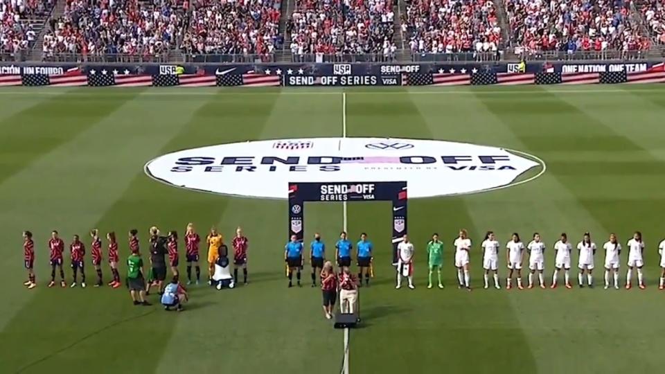 A still shows members of the US women’s soccer team facing away from the war veteran  (Screengrab/ESPN)