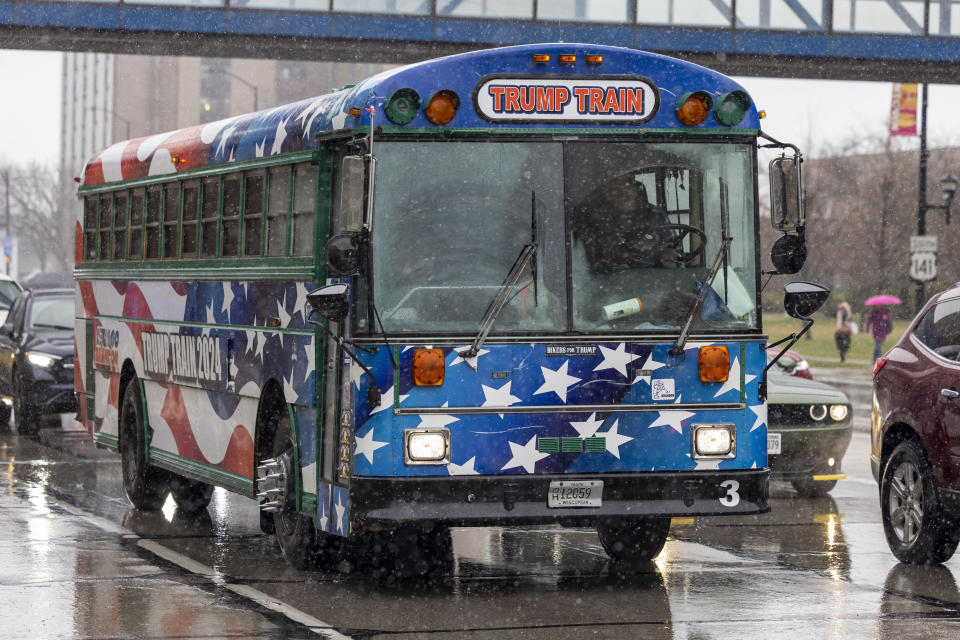 A bus painted as the Trump Train pulls up outside a rally for Republican presidential candidate former President Donald Trump April 2, 2024, in Green Bay, Wis. (AP Photo/Mike Roemer)