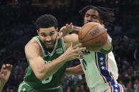 Boston Celtics forward Jayson Tatum, left, drives toward the basket past Philadelphia 76ers guard Tyrese Maxey, right, during the second half of Game 7 in the NBA basketball Eastern Conference semifinals playoff series, Sunday, May 14, 2023, in Boston. (AP Photo/Steven Senne)