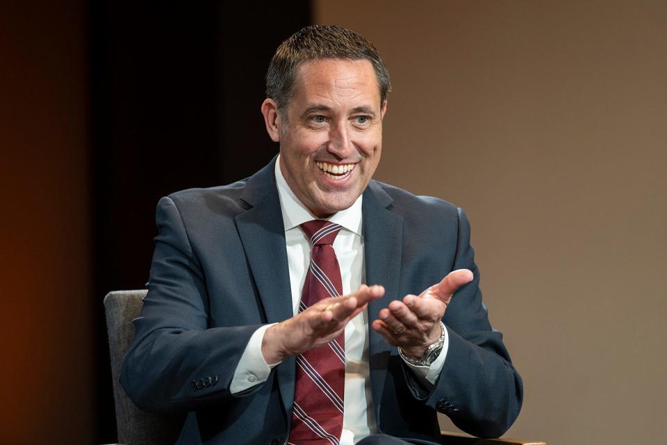 Texas Comptroller Glenn Hegar makes the hand gesture sign for money as he discusses the state's revenue estimate Monday.