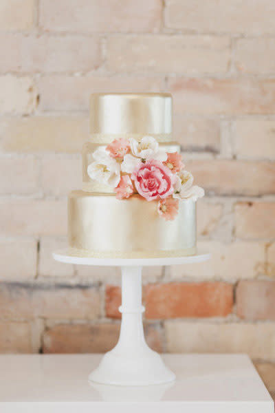 <div class="caption-credit"> Photo by: Vicky Starz Photography</div><p> <b>10) Don't gild the cake</b> <br> Top it with one XL sugar bloom instead of a cascade of edible flora to save $10 per slice. <br> <b>-$1,215</b> </p><b>Related:</b> <a href="http://www.brides.com/blogs/aisle-say/2012/07/honeymoon-destinations-united-states.html?mbid=synd_yshine" rel="nofollow noopener" target="_blank" data-ylk="slk:The Top 20 Honeymoon Resorts in the US;elm:context_link;itc:0;sec:content-canvas" class="link ">The Top 20 Honeymoon Resorts in the US</a> <br>