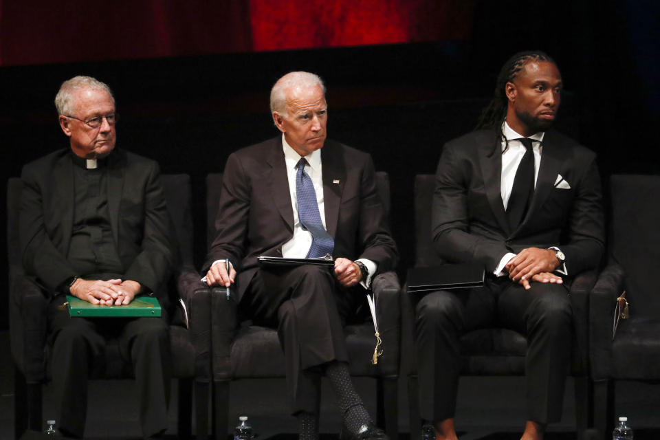 From left, Father Edward Reese, former Vice President Joe Biden and Arizona Cardinals wide receiver Larry Fitzgerald listen during memorial service at North Phoenix Baptist Church for Sen. John McCain, R-Ariz., on Thursday, Aug. 30, 2018, in Phoenix. (AP)