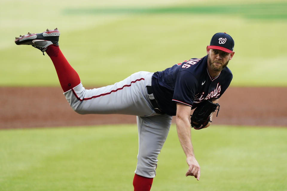 Washington Nationals starting pitcher Stephen Strasburg (37) follows through on a pitch in the first inning of a baseball game against the Atlanta Braves Tuesday, June 1, 2021, in Atlanta. (AP Photo/John Bazemore)