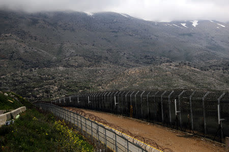 FILE PHOTO: Fences are seen on the ceasefire line between Israel and Syria in the Israeli-occupied Golan Heights March 25, 2019. REUTERS/Ammar Awad