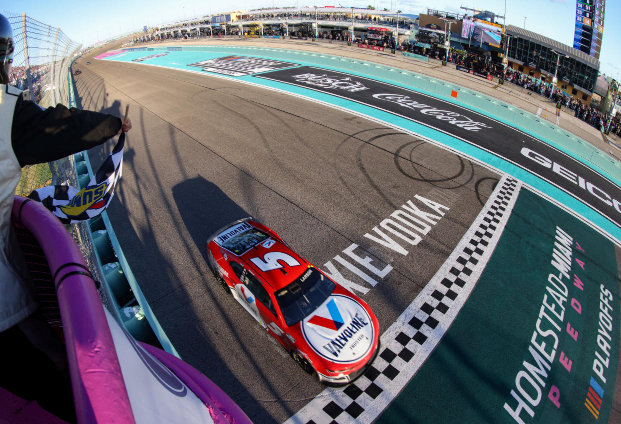 HOMESTEAD, FLORIDA - OCTOBER 23: Kyle Larson, driver of the #5 Valvoline Chevrolet, takes the checkered flag to win the NASCAR Cup Series Dixie Vodka 400 at Homestead-Miami Speedway on October 23, 2022 in Homestead, Florida. (Photo by Jared East/Getty Images)