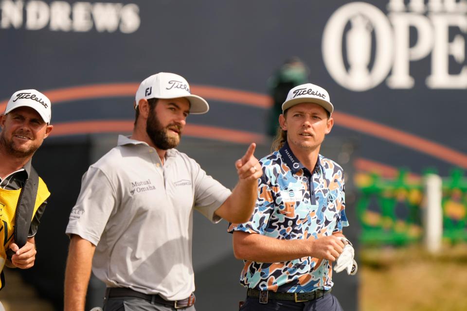 Cameron Young of the US, left, and Cameron Smith, of Australia, walk along the 1st fairway (AP)