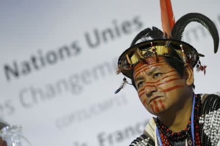 Lyndon Pishagua Chinchuya, representative of the indigenous peoples of the Peruvian Amazon, attends a meeting during the World Climate Change Conference 2015 (COP21) at Le Bourget, near Paris, France, December 8, 2015. REUTERS/Stephane Mahe