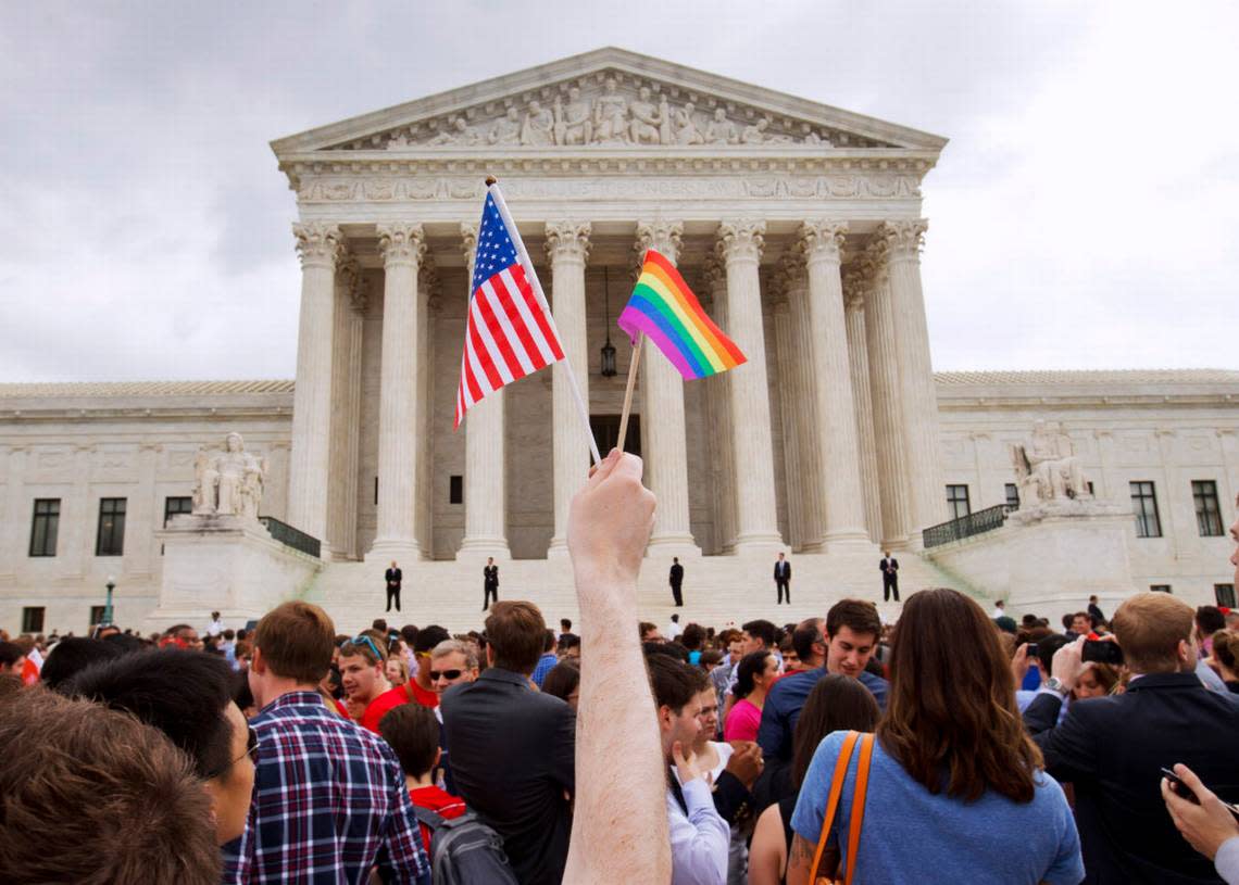 In this June 26, 2015 file photo, the crowd celebrates outside of the Supreme Court in Washington after the court declared that same-sex couples have a right to marry anywhere in the U.S.