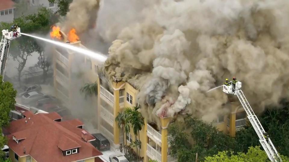 PHOTO: Firefighters work to extinguish a fire at a four-story apartment building in the city of Miami, June 10, 2024. (WPLG)