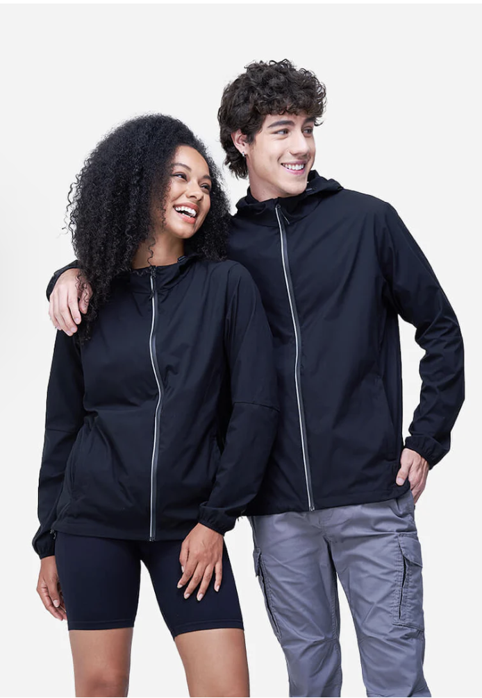 A man and woman stand in All Day Jackets