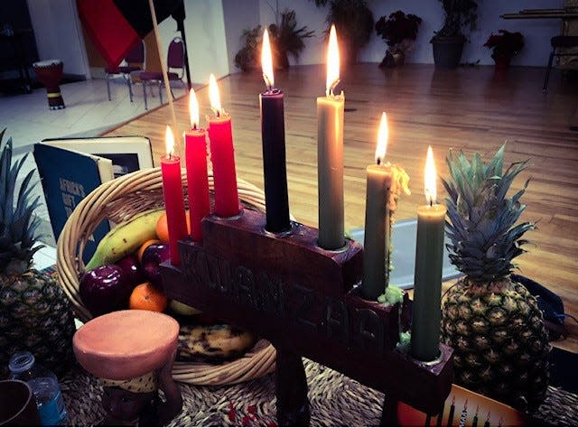 A Kwanzaa display. Each candle represents one of seven principles highlighted each day of the festival.