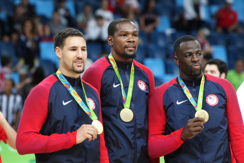 Basketball - Olympics: Day 16   Klay Thompson #11 of United States, Kevin Durant #5 of United States and Draymond Green #14 of United States with their gold medals after the USA Vs Serbia Men's Basketball Gold Medal game at Carioca Arena1on August 21, 2016 in Rio de Janeiro, Brazil. (Photo by Tim Clayton/Corbis via Getty Images)