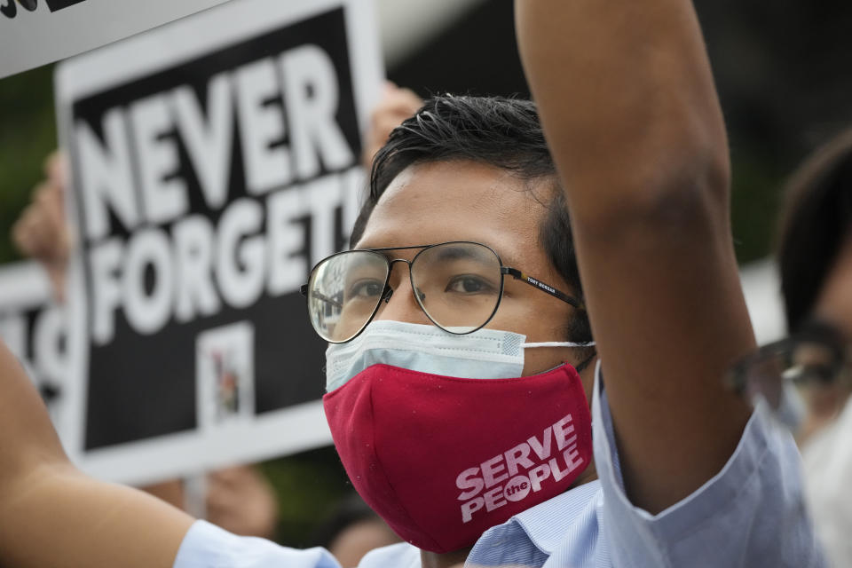 An activist shouts slogans during a short rally in Quezon city, Philippines, Thursday, July 21, 2022. Activists and human rights victims launched a new campaign in the Philippines Thursday to memorialize and prevent a repeat of the abuses and plunder that marked the martial-law era 50 years ago under the dictator-father of new President Ferdinand Marcos Jr. (AP Photo/Aaron Favila)