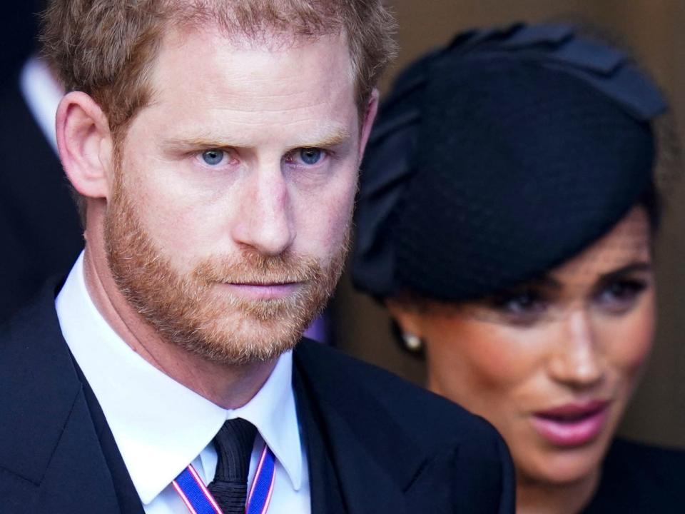 Prince Harry and Meghan Markle leave a service for the reception of Queen Elizabeth II's coffin at Westminster Hall in London on September 14, 2022.