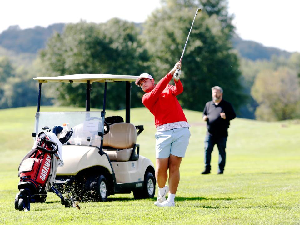 Garaway senior Nick Maust hits an approach shot during a Division III district golf tournament on Wednesday, Oct. 2, 2024, at River Greens in West Lafayette.