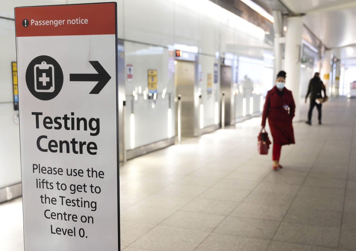 Photo by: zz/KGC-254/STAR MAX/IPx 2021 2/12/21 Signs directing airline passengers to a COVID-19 Testing Centre are seen on February 12, 2021 at London Heathrow Airport during the worldwide coronavirus pandemic. Emergency lockdown restrictions are continued in The United Kingdom as health officials take measures to prevent a new variant of the virus from affecting greater Europe. (London, England, UK)