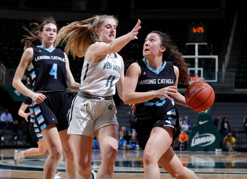 Lansing Catholic's Gabby Halliwill, right, drives against Grand Rapids West Catholic's Ellie Bies, Friday, March 17, 2023, in East Lansing.