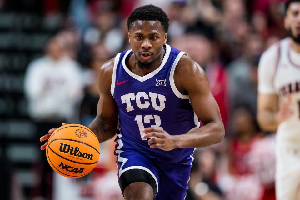 LUBBOCK, TEXAS - FEBRUARY 25: Guard Shahada Wells #13 of the TCU Horned Frogs handles the ball during the first half of the college basketball game against the Texas Tech Red Raiders at United Supermarkets Arena on February 25, 2023 in Lubbock, Texas. (Photo by John E. Moore III/Getty Images) ORG XMIT: 775898460 ORIG FILE ID: 1469524844