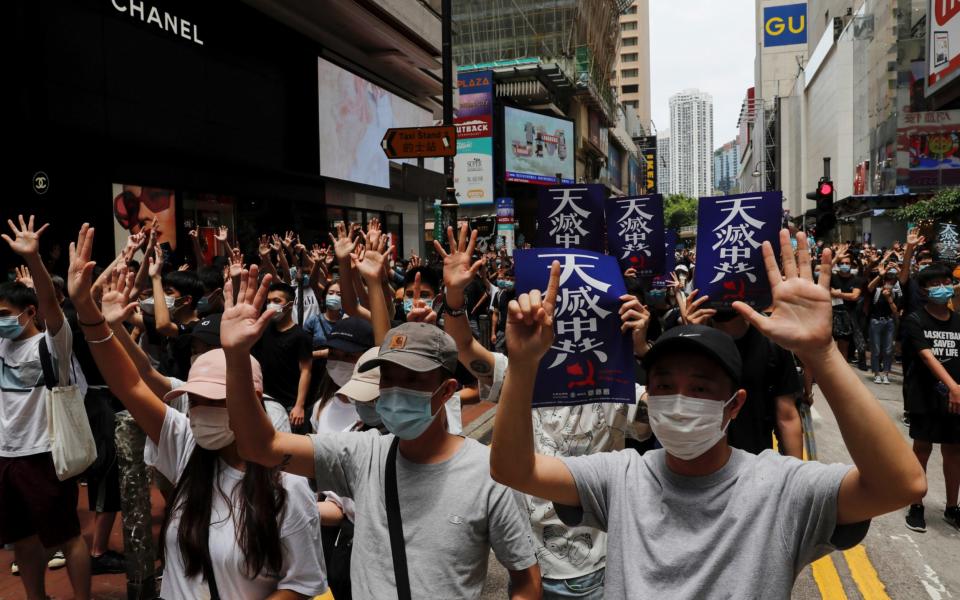 Anti-government protesters march again Beijing's plans to impose national security legislation in Hong Kong - Reuters