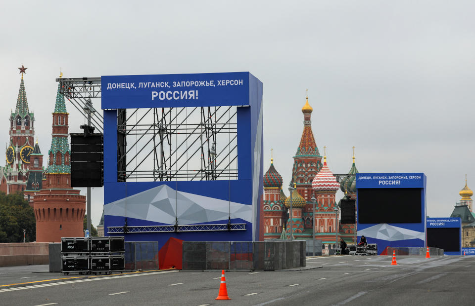 A view shows screens and banners on constructions erected ahead of an expected event, dedicated to the results of referendums on the joining of four Ukrainian self-proclaimed regions to Russia, near the Kremlin and Red Square in central Moscow, Russia September 29, 2022. Banners read: 