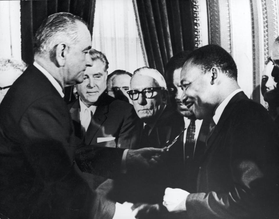 President Lyndon Johnson hands a pen to Rev. Martin Luther King Jr. after signing the Voting Rights Act on Aug. 6, 1965. <a href="https://www.gettyimages.com/detail/news-photo/president-lyndon-b-johnson-hands-a-pen-to-civil-rights-news-photo/1749781?adppopup=true" rel="nofollow noopener" target="_blank" data-ylk="slk:Getty Images;elm:context_link;itc:0;sec:content-canvas" class="link ">Getty Images</a>