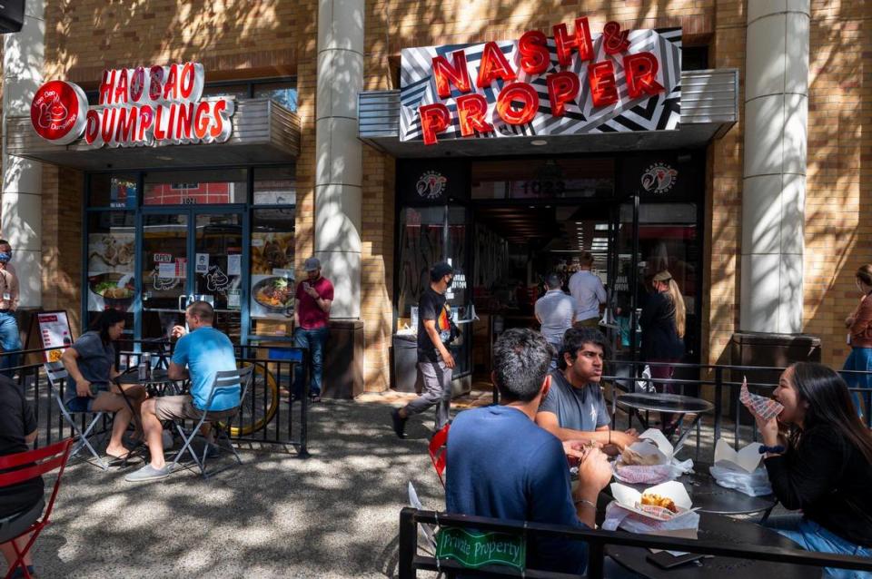 Nash and Proper customers eat at the new takeout restaurant on Thursday, Sept. 24, 2020, on K street in downtown Sacramento.