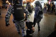 FILE - Riot police detain a demonstrator during a protest against mobilization in Moscow, Russia, Wednesday, Sept. 21, 2022. Russian President Vladimir Putin has ordered a partial mobilization of reservists in Russia, effective immediately. (AP Photo, File)