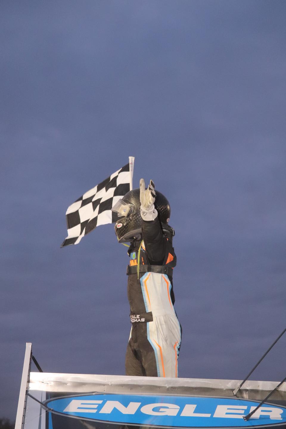 Cale Thomas celebrates in Victory Lane after winning on opening night at Fremont Speedway.