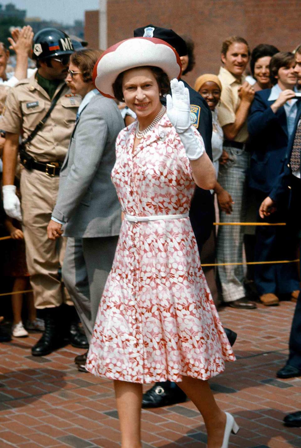 Queen Elizabeth ll waves to well-wishers in Boston during a State Visit to America on July 01, 1976 in Boston, USA.